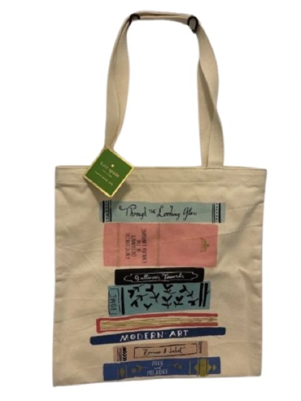 kate spade cream canvas tote with colorful book stack print